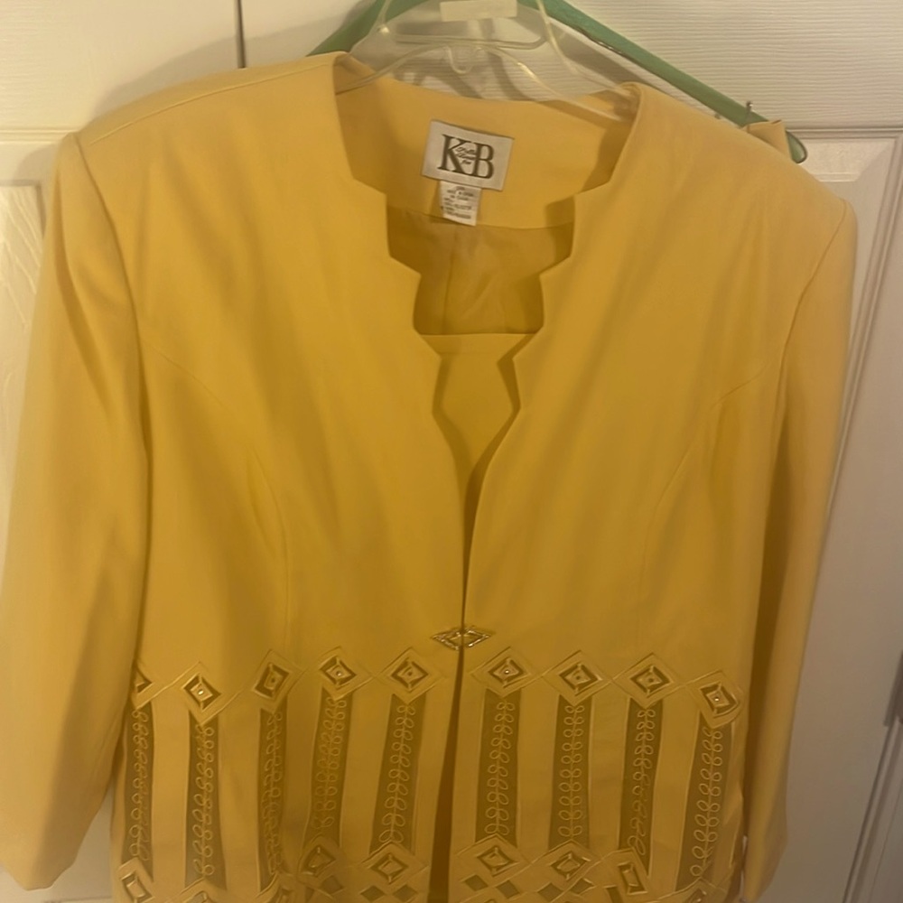 Elegance at its best with this Gold suit. Never worn with tags.